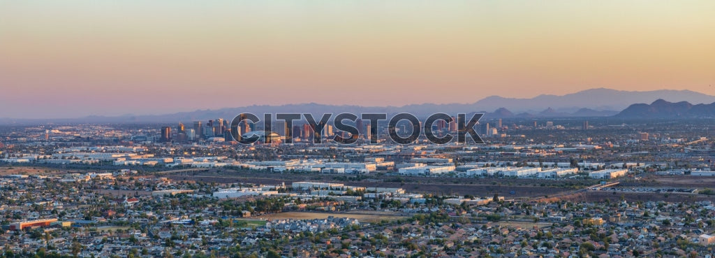 Phoenix cityscape at sunrise with mountain backdrop