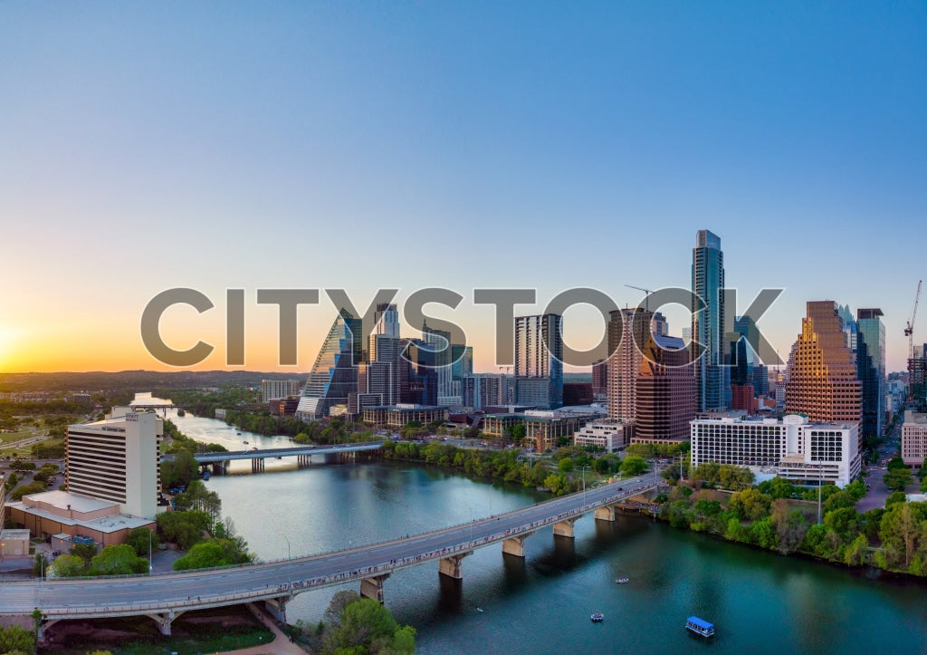 Austin cityscape during sunset with river and bridges