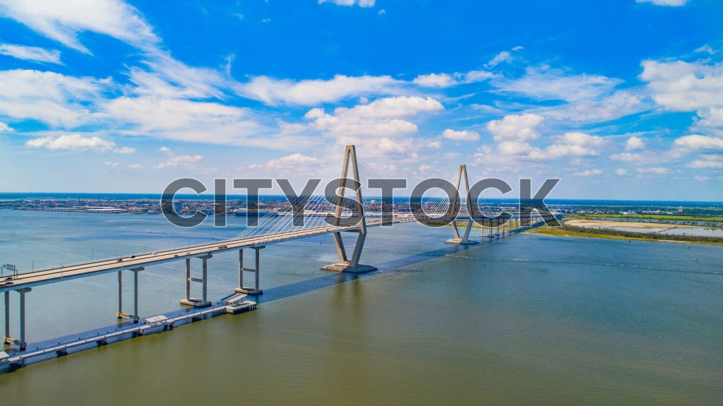 Aerial view of Arthur Ravenel Jr. Bridge in Charleston under clear blue skies