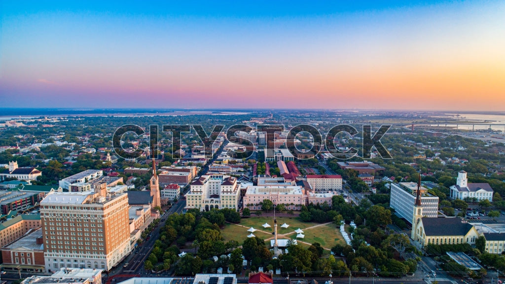 Aerial view of Charleston, SC, highlighting historic buildings at sunrise