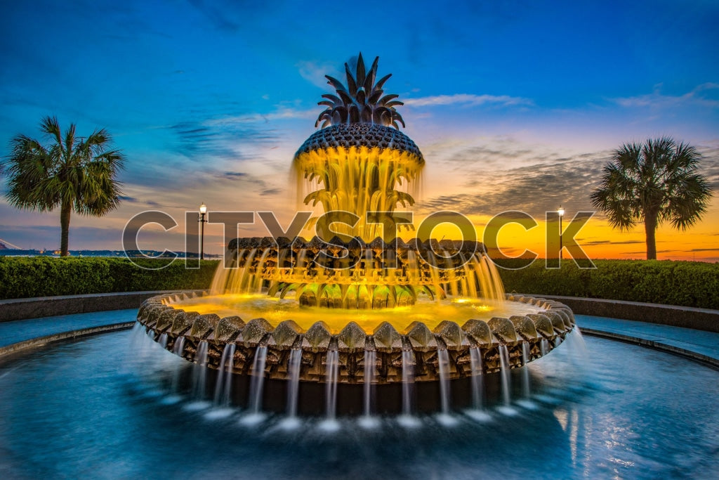 Pineapple Fountain in Charleston, SC with sunset and palm trees