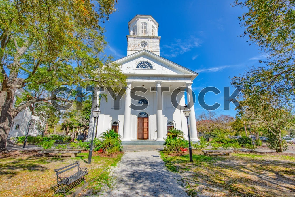 Historic church in Charleston with lush surroundings on a clear day