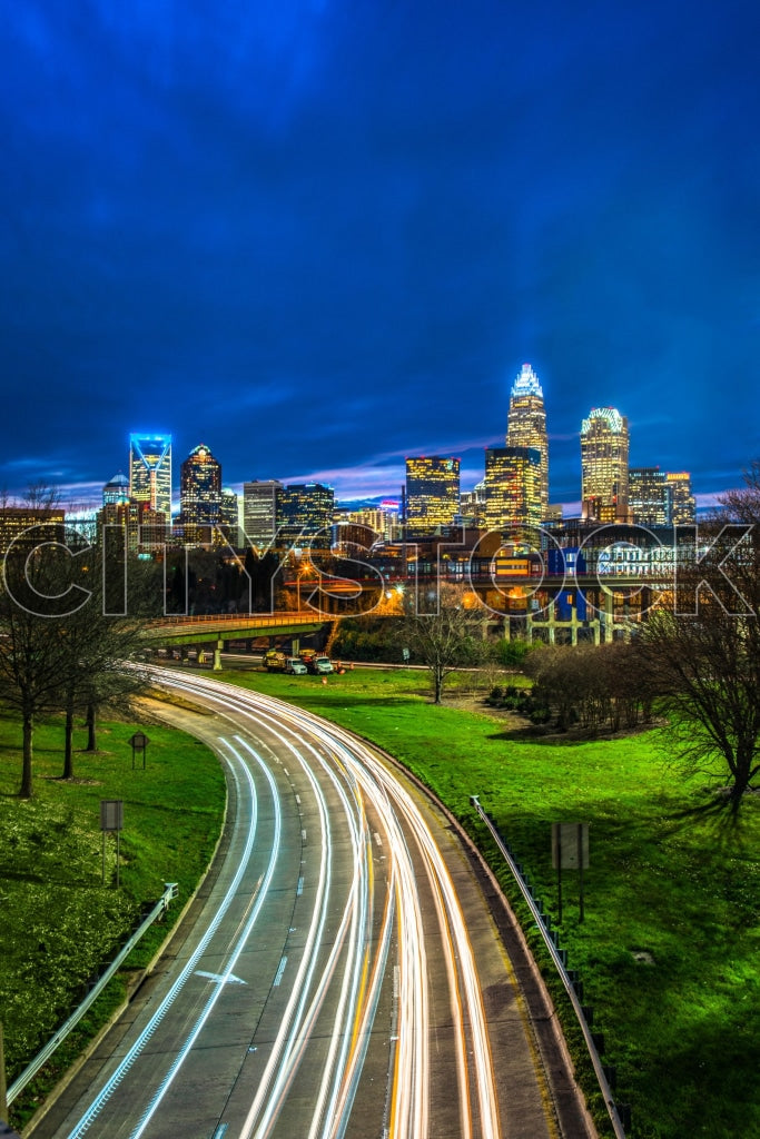 Charlotte skyline with highway traffic at night