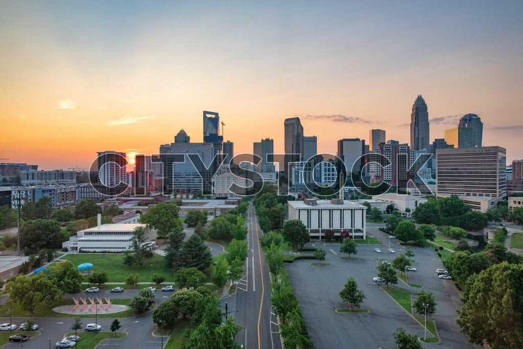 Charlotte skyline at dusk with a vivid sunset backdrop