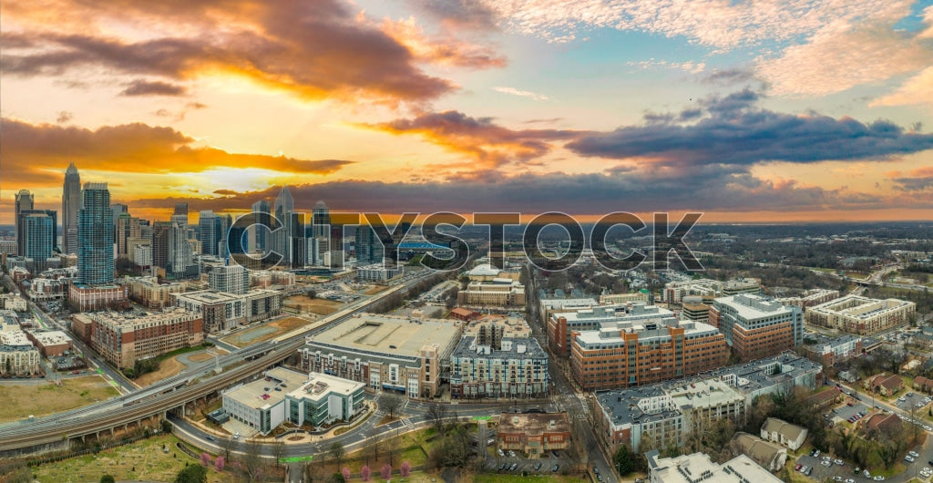 Panoramic view of Charlotte NC skyline during sunset with colorful clouds