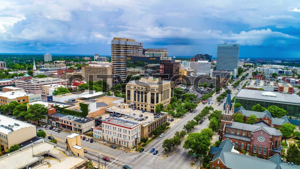 Aerial cityscape of Columbia, SC with blue skies and storm clouds