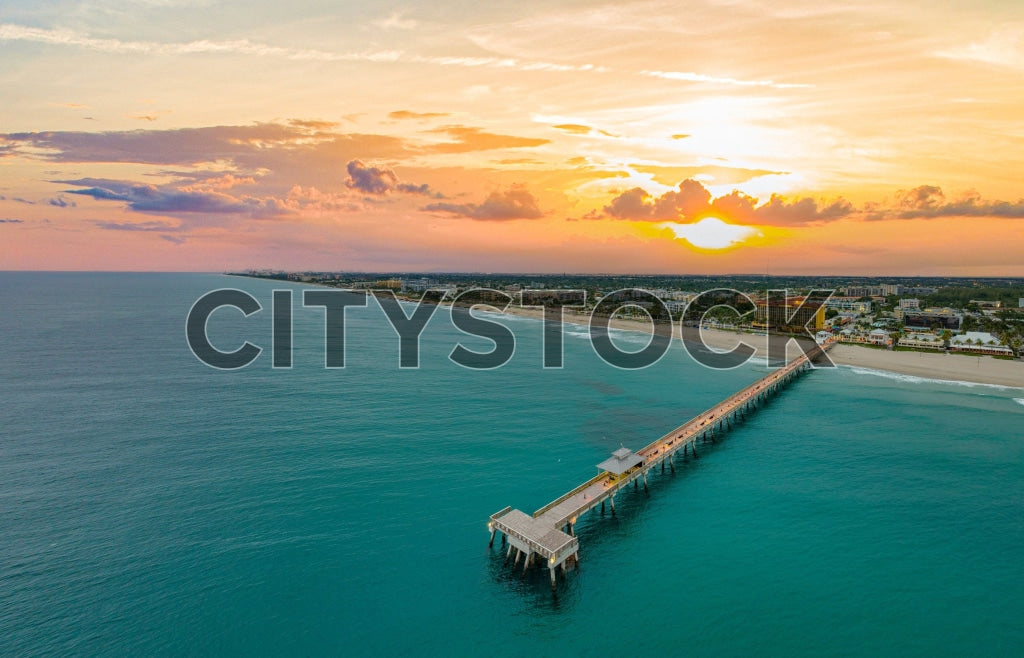 Aerial view of sunset at Deerfield Beach Pier in Florida with Atlantic Ocean