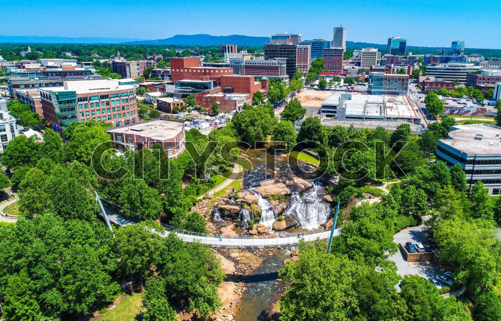 Aerial view of Greenville, SC showing blue skies and green spaces