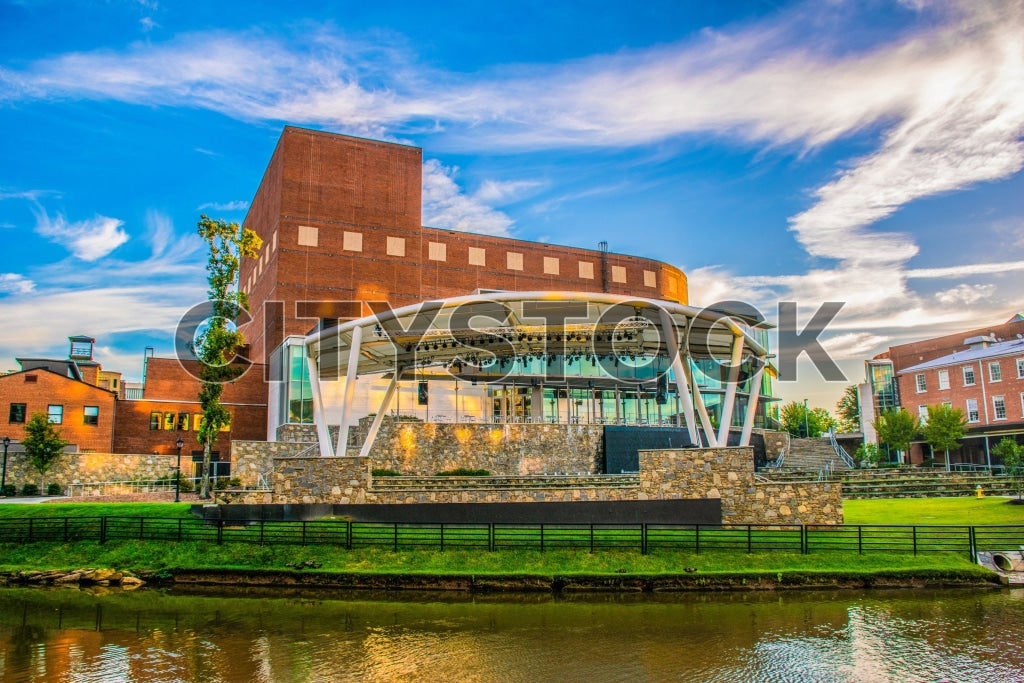 Sunset view of Greenville, SC showcasing river and buildings