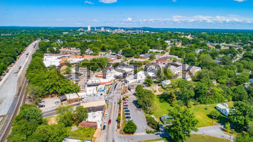 Aerial view of Greenville SC showcasing urban and green areas