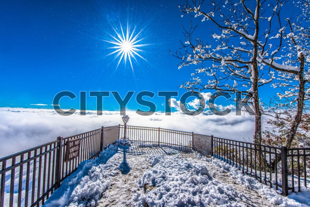 Sunburst over snow and clouds at Greenville lookout