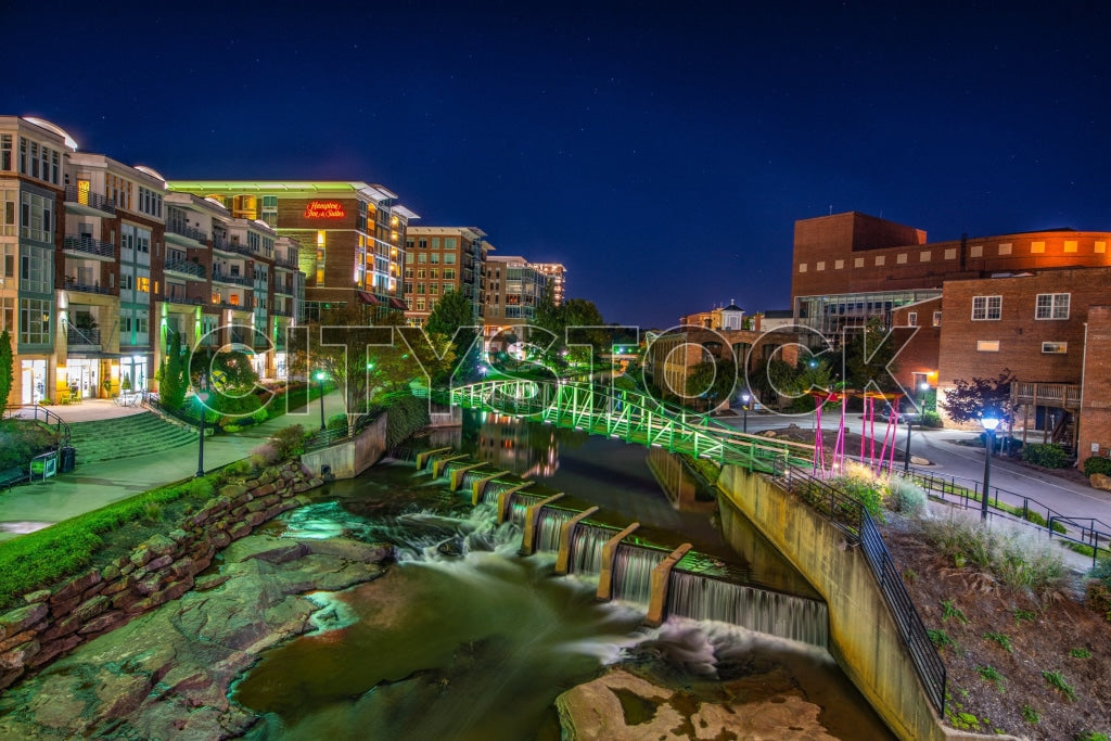 Greenville, SC riverfront with modern architecture at night