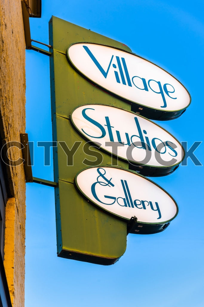 Village Studio & Gallery rustic multi-tiered sign in Greenville, SC