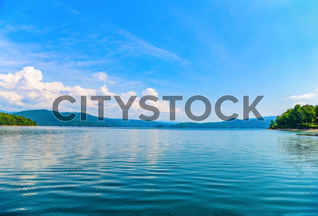 Tranquil Greenville lake with mountains and clear blue sky