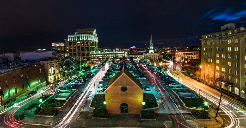 Aerial night view of Greenville SC showing historic and modern buildings