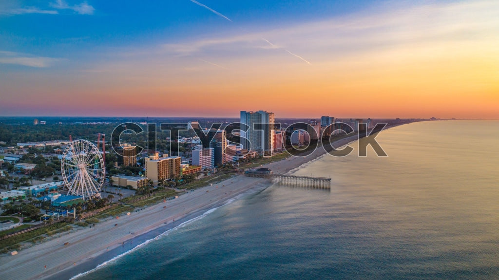 Aerial view of Myrtle Beach with ferris wheel and sunrise