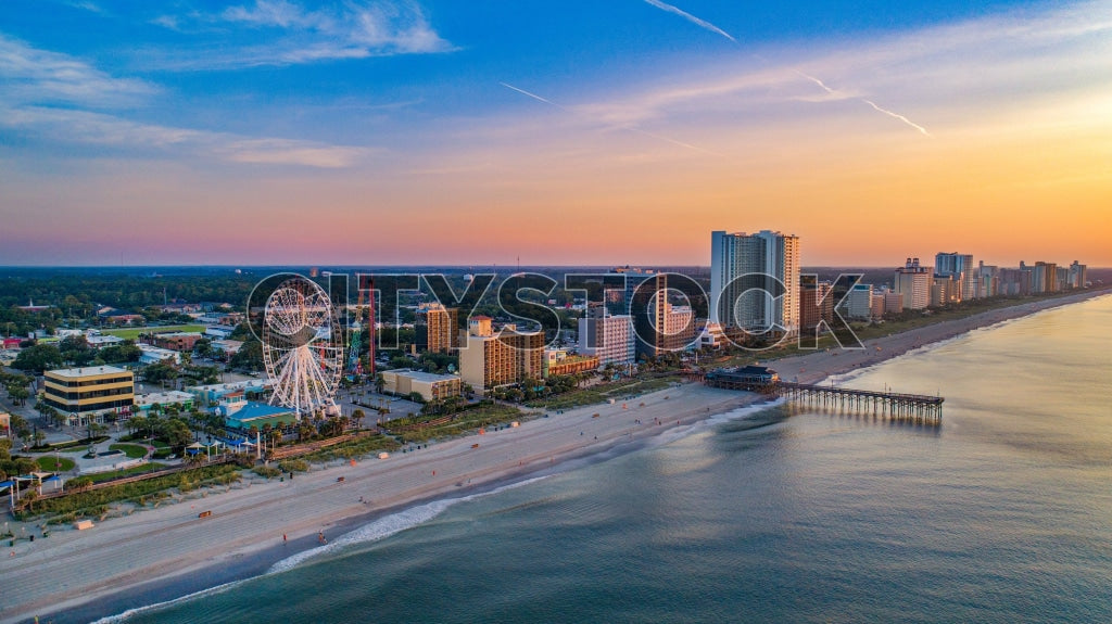 Aerial view of Myrtle Beach skyline at sunrise with Ferris wheel