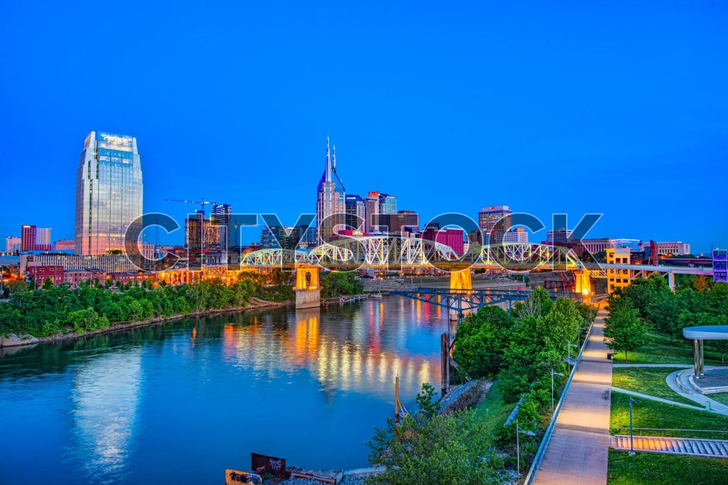 Nashville skyline, Seigenthaler Bridge and river reflections at dusk