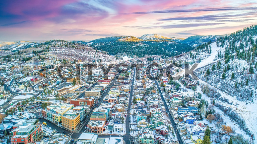 Aerial view of Park City, Utah covered in snow at sunrise