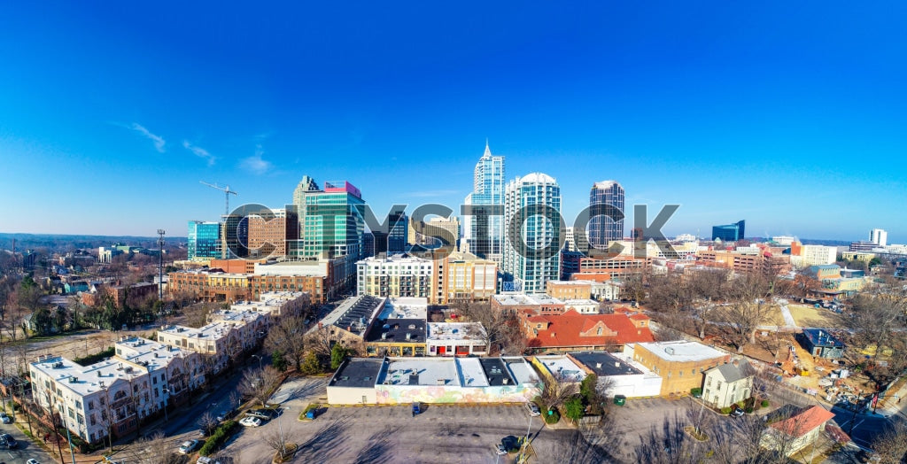 Aerial view of Raleigh skyline with high-rises and blue skies