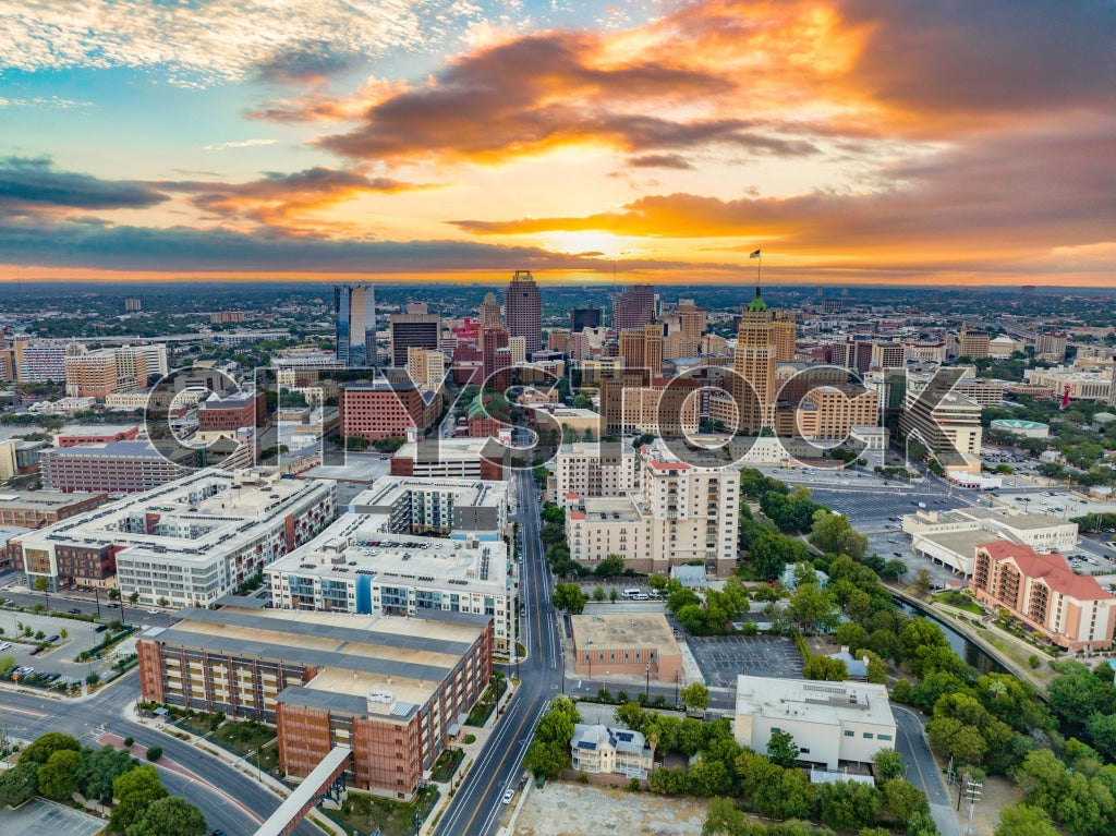 Aerial view of San Antonio skyline at sunrise with vibrant colors